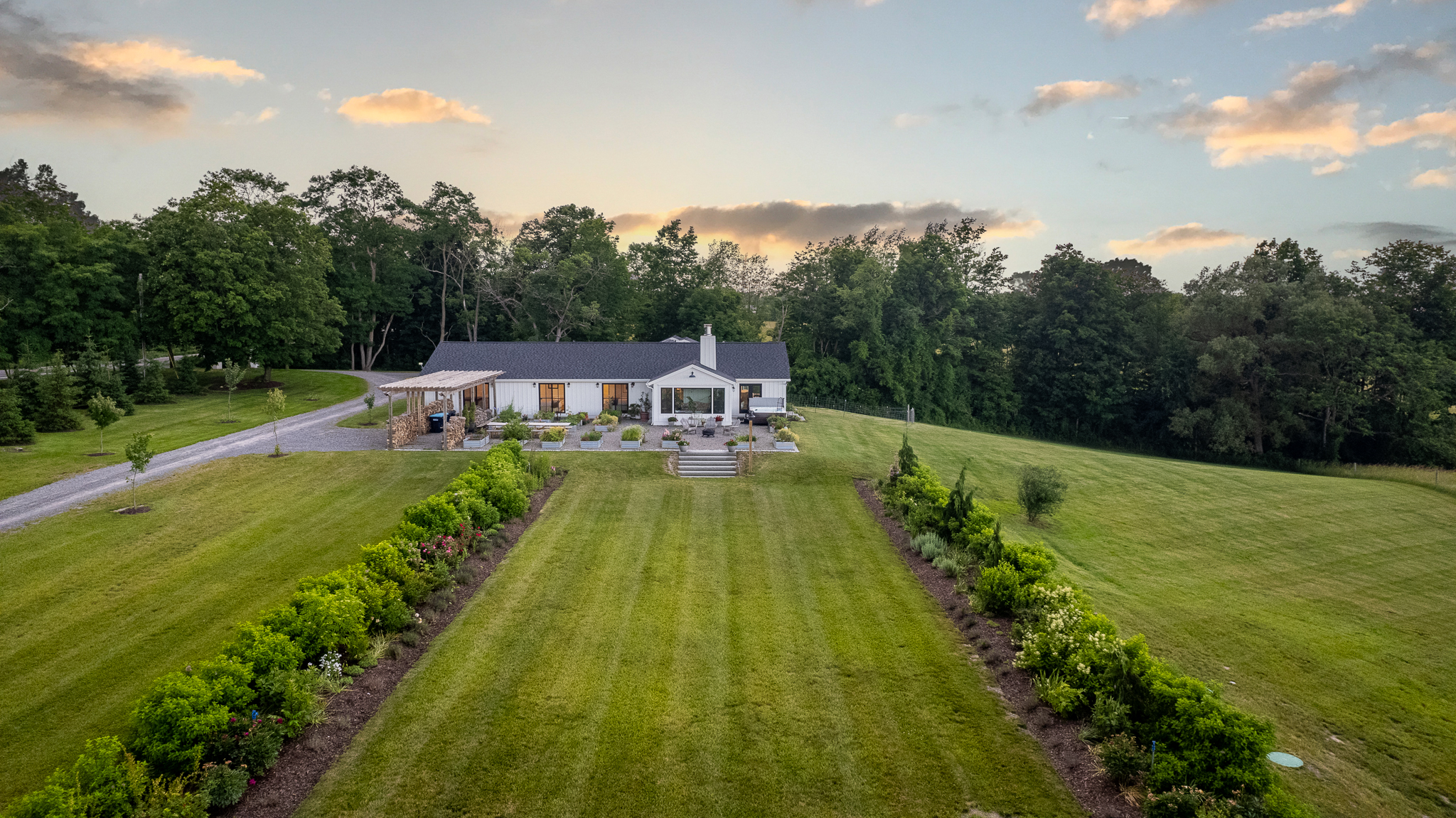 West Lake Farm home and formal gardens at sunset